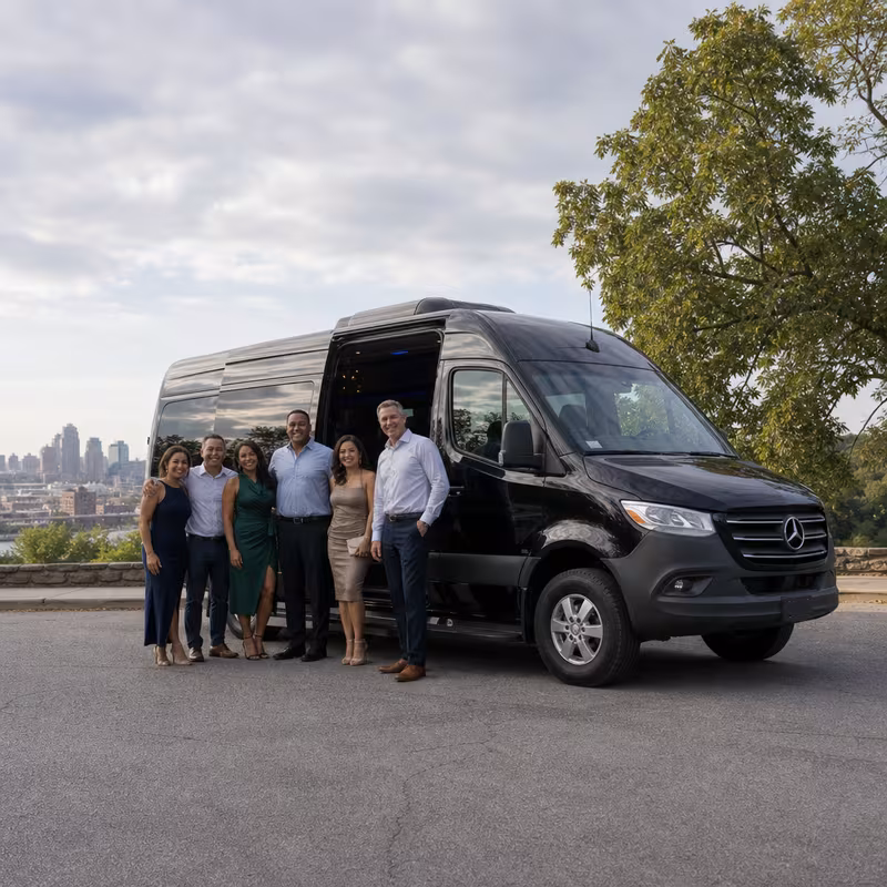 Group beside a Mercedes Sprinter limo from the Kansas City fleet at the beach