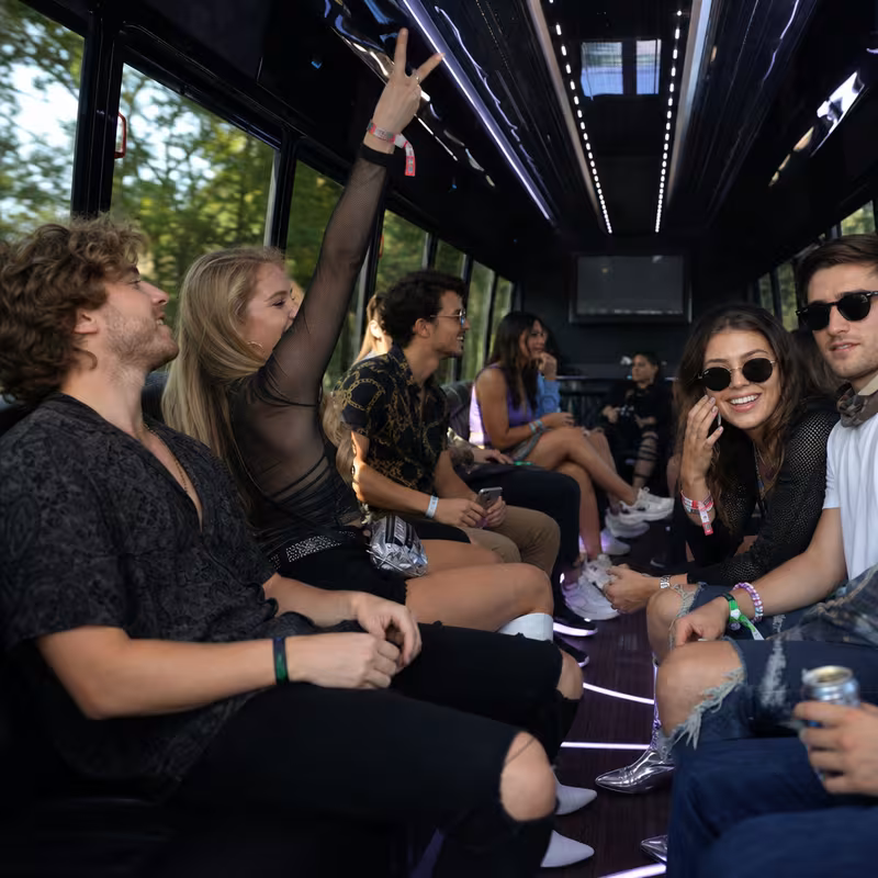 Passengers loading luggage while boarding an Kansas City group shuttle