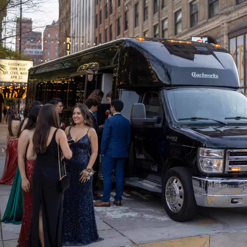 Passengers loading luggage while boarding an Kansas City group shuttle