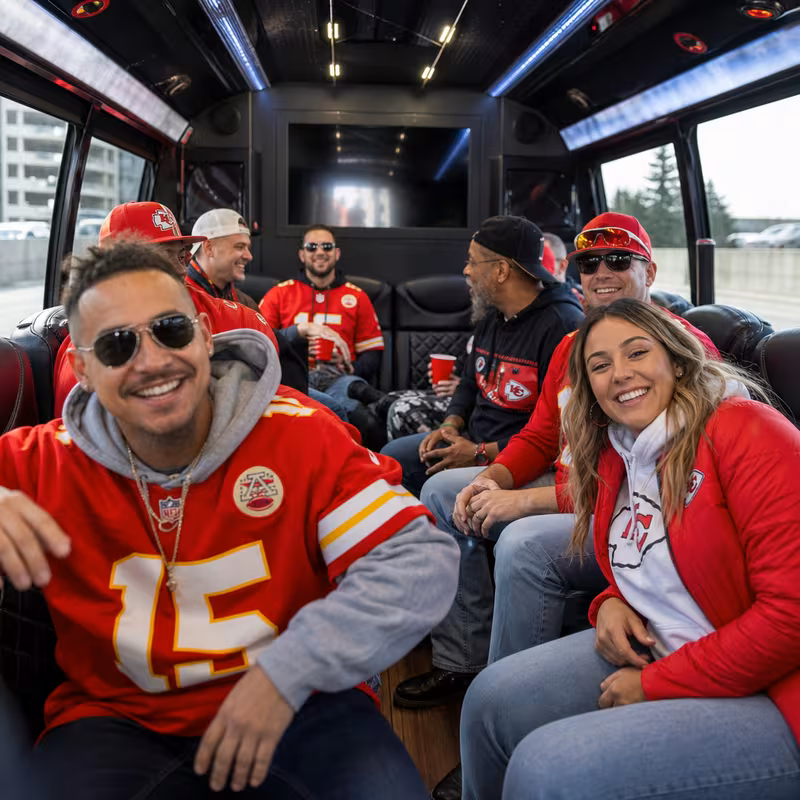 Group boarding a white charter bus for Sporting Event Transportation transportation in Kansas City
