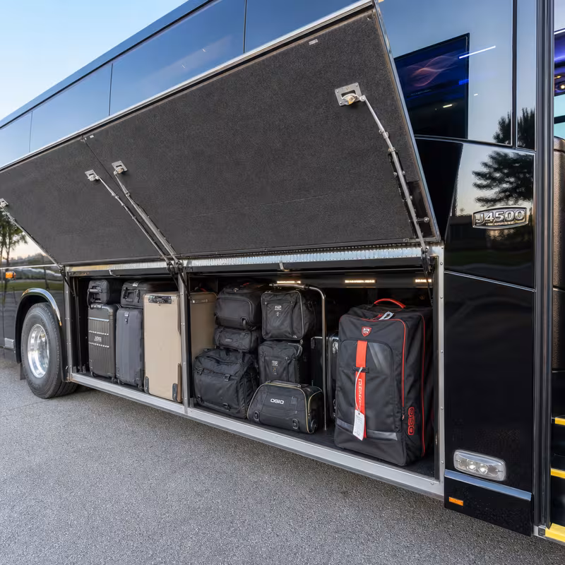 Party bus interior with wraparound leather seating and LED lighting in Kansas City