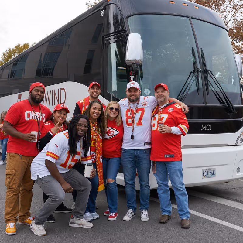 Passengers loading luggage while boarding an Kansas City group shuttle