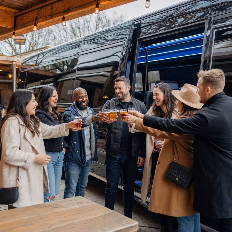 Passengers loading luggage while boarding an Kansas City group shuttle